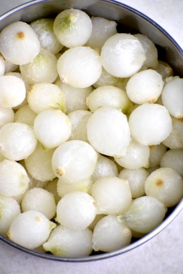 A bowl of frozen pearl onions.