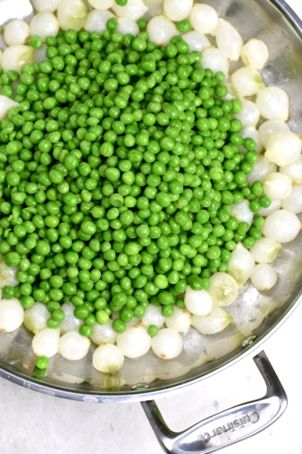 Peas added into the pan.